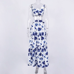 Detail of floral two-piece set featuring crop camisole and layered maxi skirt