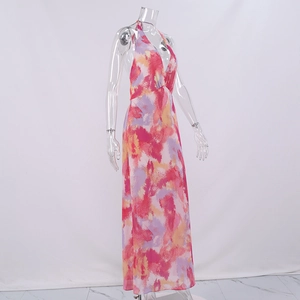 Detail of vibrant abstract print and halter V-neckline on a summer mesh long dress