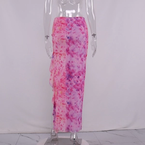 Detail view of pink floral ruffles and high-slit texture on summer maxi skirt