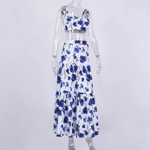 Detail of blue floral print camisole and layered maxi skirt set on a model