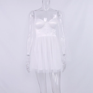 Close-up of white mesh mini dress with corset bodice and sheer puff sleeves
