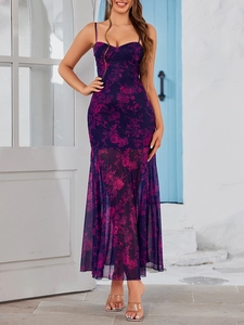 Detail of floral backless maxi dress with mesh mermaid hem and purple flower pattern
