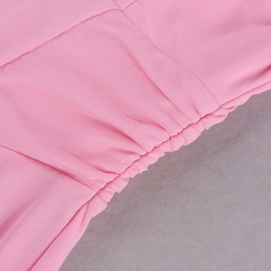 Detail of pink mesh fabric showing precise ruching and pleated textile texture