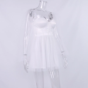Detail of white corset mesh dress featuring tulle skirt and delicate shoulder drapes