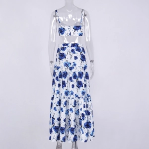 Back view of floral blue two-piece set featuring a cropped camisole and tiered maxi skirt
