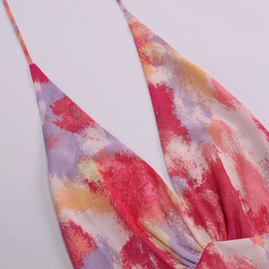 Detailed close-up of vibrant abstract oil painting print on sexy V-neck mesh dress