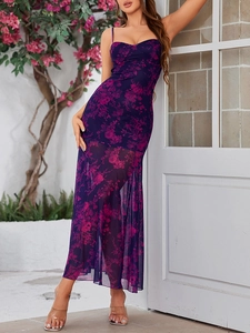 Detail of floral backless dress with spaghetti straps and sheer mesh hemline