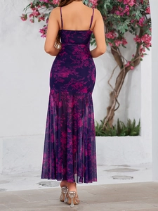 Detail view of the open back and mesh mermaid hem on a purple floral maxi dress