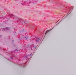 Detailed view of floral print stretch fabric and high-quality side seam stitching