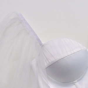 Close-up of white mesh sleeves and satin bodice on a romantic square neck dress