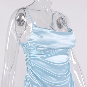 Detail of light blue satin dress featuring a cowl neck and side ruching texture