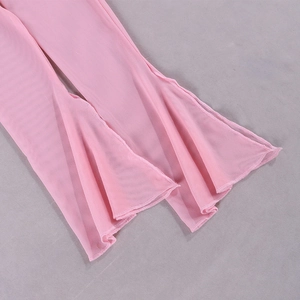 Detail of pink mesh bell-bottom hems featuring delicate lettuce edge and sheer texture