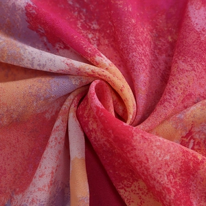 Detailed close-up of vibrant abstract print mesh fabric with soft translucent texture