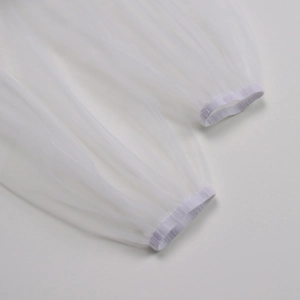 Detailed macro view of white mesh dress sleeve with elastic cuff and translucent texture