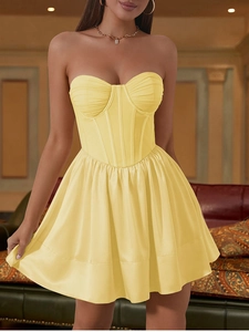 Detailed view of yellow mesh corset dress featuring underwire boning and bust padding detail
