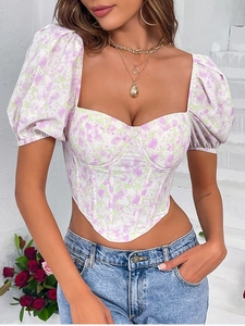 Detailed close-up of floral corset top with puff sleeves and heart-shaped neckline