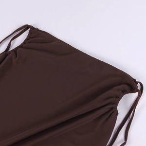 Detail of dark brown knit fabric with adjustable drawstring and ruched texture