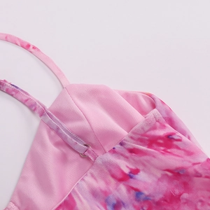 Detail of pink purple tie-dye mesh fabric on sexy backless maxi dress with fine straps