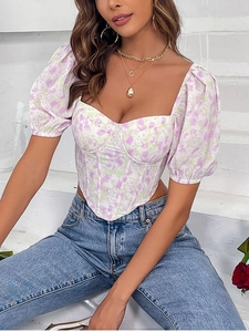 Detailed close-up of floral puff sleeve corset top with fishbone structure and sweetheart neck