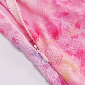 Detail of pink tie-dye dress featuring a seamless invisible zipper and textured fabric