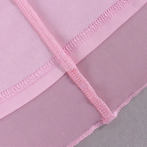 Macro shot of pink mesh and knit fabric stitching with high-quality overlock seam detail