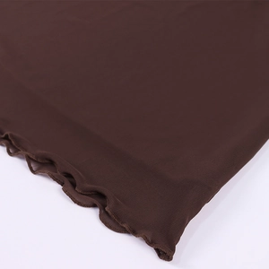 Close-up of dark brown mesh fabric featuring a delicate lettuce hem for skirts