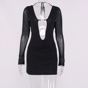Detail of sheer mesh sleeves and deep V-neckline with gold metal buckle on black dress