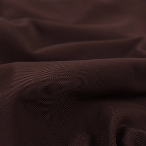 Macro close-up of dark brown knit fabric texture on a summer fishtail maxi skirt