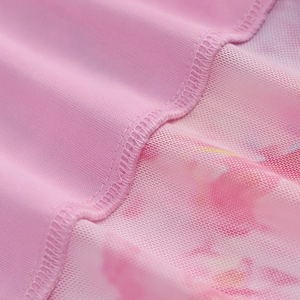 Close-up of pink floral mesh fabric detailing breathable texture and fine stitching