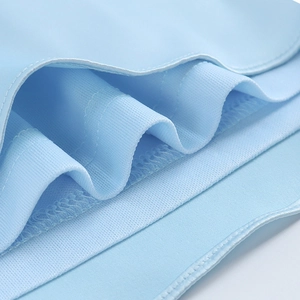 Detailed view of light blue satin fabric featuring clean stitching and soft wavy texture
