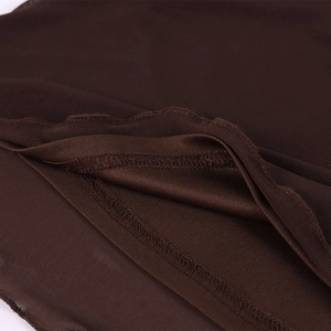 Detail shot of dark brown mesh fabric showing fine mesh texture and quality stitching
