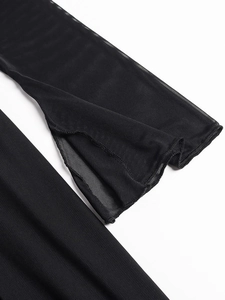 Detailed view of the sheer mesh fabric and side slit design on a black maxi dress