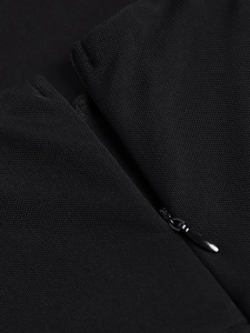 Detailed macro view of the seamless invisible zipper on this black mesh dress