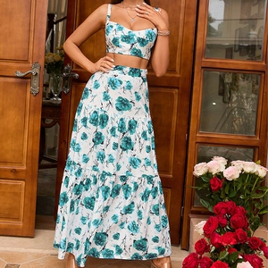 Floral two-piece set featuring a cropped camisole top and layered maxi skirt in white