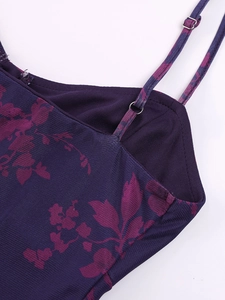 Detail of adjustable thin straps and mesh fabric texture on purple floral maxi dress