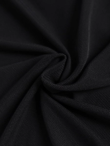 Macro view of black breathable mesh fabric texture and rhythmic material folds