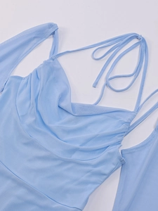 Detail of light blue mesh halter top featuring draped neckline and off-shoulder sleeves