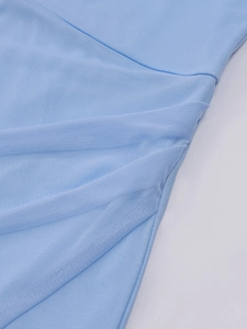 Detail of light blue mesh fabric featuring elegant side ruched and pleated design texture