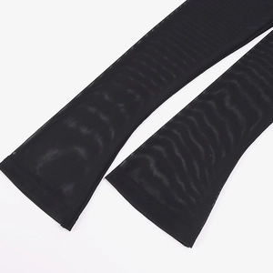Close-up of black sheer mesh dress sleeve showing fine texture and hem detail