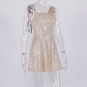 Detail of champagne gold sequined mini dress featuring thin straps and square neckline