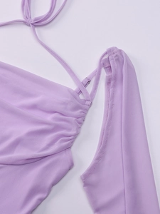 Detail of lavender mesh halter dress showing pleated chest design and drawstring texture