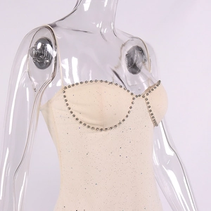 Close-up of heart-shaped neckline with sparkling rhinestones and glitter fabric detail