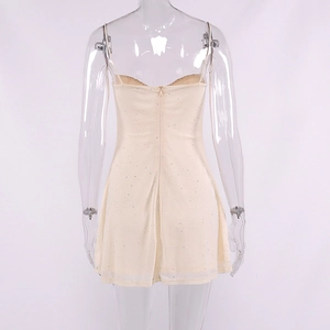Close-up of beige sequin mini dress featuring a back hidden zipper and thin straps