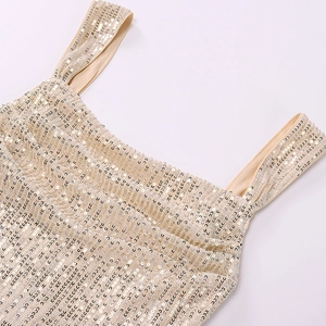 Detailed macro view of champagne sequin dress straps and square neckline texture