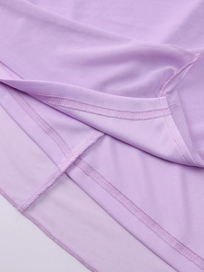 Macro detail of breathable purple mesh fabric and premium double stitching on the dress