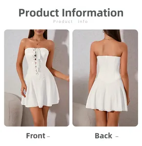 Detail of white corset tube dress with lace-up front and pleated A-line skirt