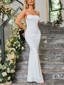 Detail of elegant white fishtail dress with ruched bodice and thin shoulder straps