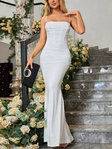 Detail of white spaghetti strap fishtail dress featuring elegant ruched pleats and slim fit