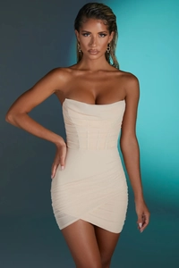 Close-up of the elegant corset-style mesh mini dress with ruched details and bone support