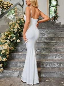 Detail of elegant white fishtail dress featuring hidden back zipper and slim fit mermaid hem